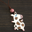 Dancing cow pendant