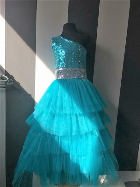 Beautiful tulle ruffles and shimmering girls turquoise dress Beautiful tulle ruffles and shimmering girls turquoise dress
