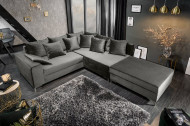 Moderne hoekbank LOFT 220cm zilvergrijs fluweel stof incl Hocker en kussens.lounge gedeelte aan beide zijden op te monteren.
