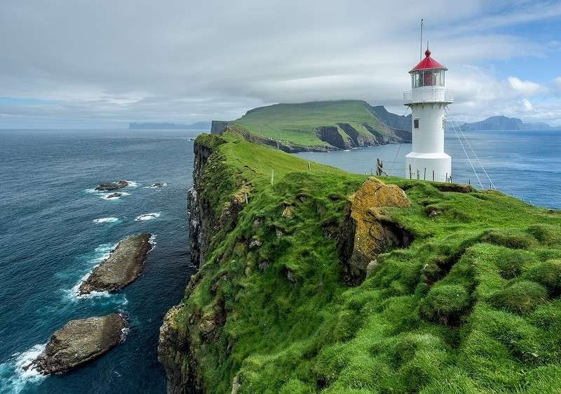 Lighthouse on a small green island wallpaper - 13020