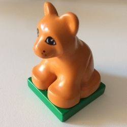2334c03pb01-29G DUPLO welp op groene plaat (PAKKETPOST) oranje, aardekleurig gebruikt *