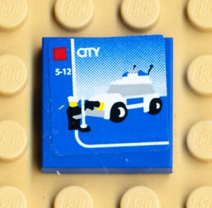 3068bpb0320-7G Tegel 2x2 Politieauto (Sticker) blauw gebruikt *5T05-23