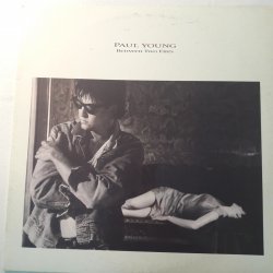 Paul Young ‎– албум Between Two Fires