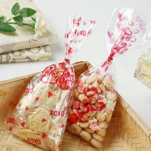 Set de 100 pungi pentru dulciuri Kesote, platic, transparent/rosu, 27,5 x 12,5 cm