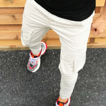 Pantaloni barbati casual gri, conici, cu buzunare laterale aplicate