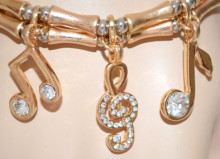 BRACCIALE donna cristalli CIONDOLI ORO ARGENTO dorato elastico a molla note musicali bracelet 655